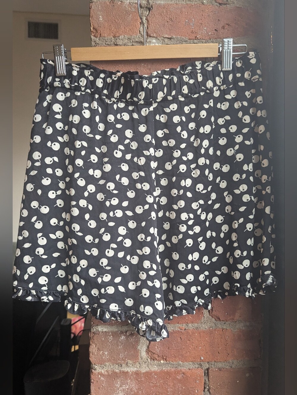 Meave Anthropologie Black Shorts with Cream Dot Print and Ruffle Hem
